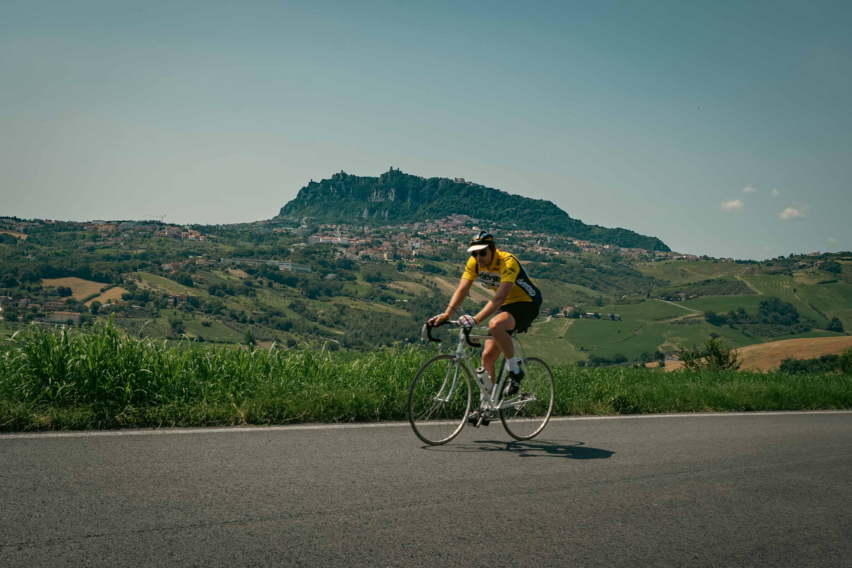 Cycling with Monte Titano in the background